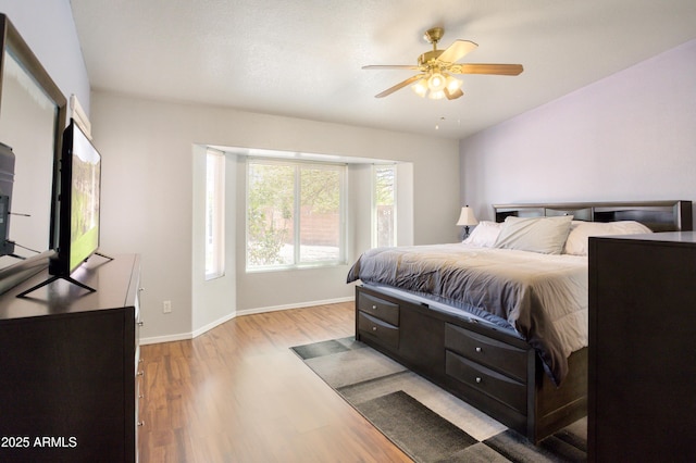 3501 Camino Bella Rosa, Sierra Vista, AZ 85650 - bedroom with baseboards, ceiling fan, and light wood-style flooring