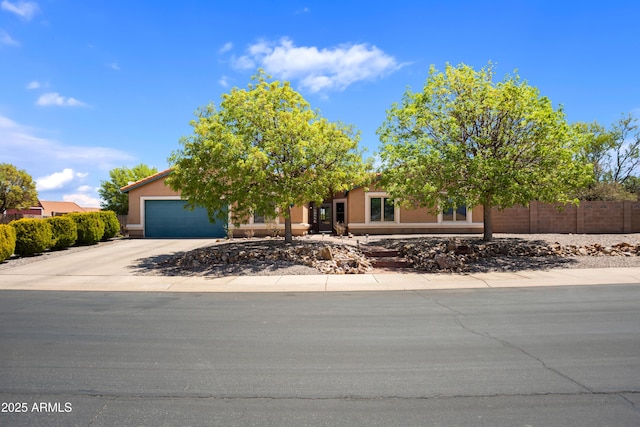 3501 Camino Bella Rosa, Sierra Vista, AZ 85650 - view of property hidden behind natural elements featuring fence, an attached garage, and concrete driveway