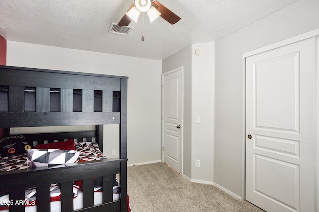 3501 Camino Bella Rosa, Sierra Vista, AZ 85650 - carpeted bedroom featuring baseboards, a ceiling fan, a textured ceiling, and visible vents