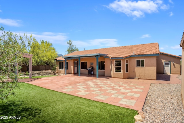 3501 Camino Bella Rosa, Sierra Vista, AZ 85650 - back of house with fence, stucco siding, a patio area, a tiled roof, and a yard