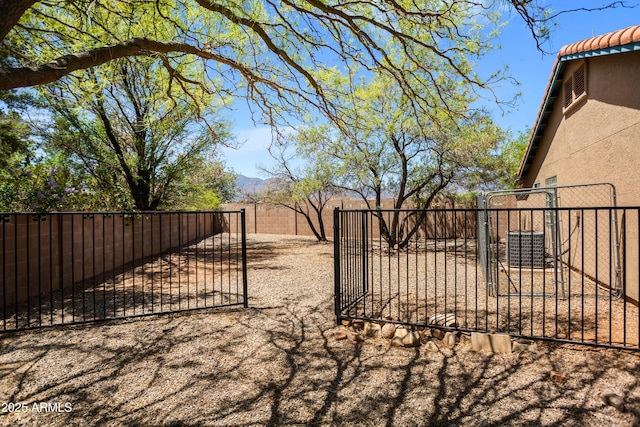 3501 Camino Bella Rosa, Sierra Vista, AZ 85650 - view of yard with central AC, a gate, and a fenced backyard