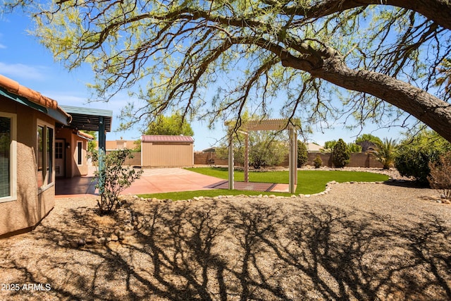 3501 Camino Bella Rosa, Sierra Vista, AZ 85650 - view of yard with a fenced backyard, an outbuilding, a patio area, and a shed