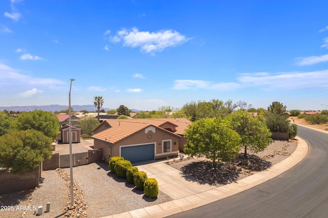 3501 Camino Bella Rosa, Sierra Vista, AZ 85650 - view of front of home with fence, stucco siding, concrete driveway, an attached garage, and a tile roof