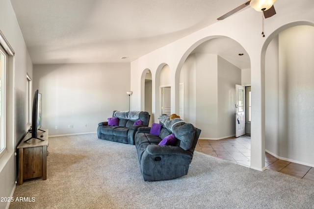 3501 Camino Bella Rosa, Sierra Vista, AZ 85650 - tiled living room with ceiling fan, baseboards, and carpet