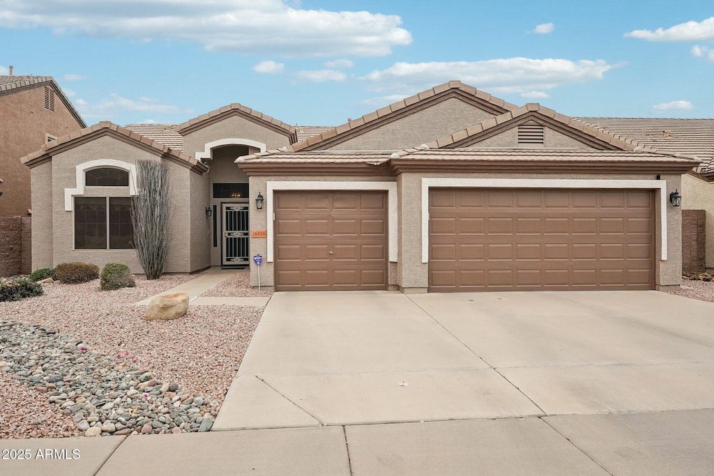 single story home featuring a garage