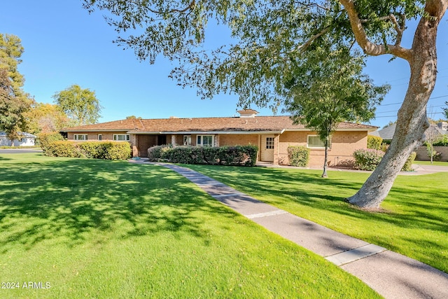 single story home featuring a front yard