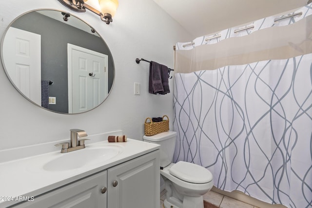 bathroom with tile patterned floors, vanity, toilet, and curtained shower