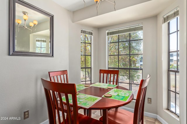 dining space featuring a chandelier and a healthy amount of sunlight