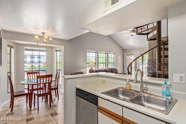 kitchen featuring dishwasher, sink, vaulted ceiling, a textured ceiling, and white cabinets