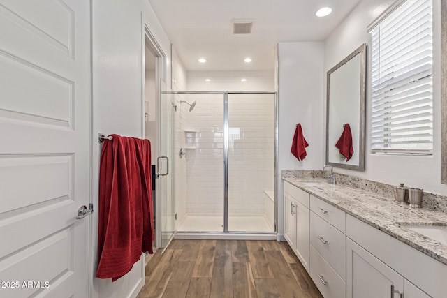 19415 W College Dr, Litchfield Park, AZ 85340 - full bath featuring a stall shower, double vanity, wood finished floors, and recessed lighting