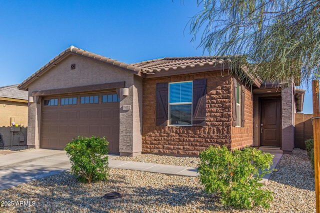 19415 W College Dr, Litchfield Park, AZ 85340 - ranch-style home featuring a garage, concrete driveway, stucco siding, and a tile roof