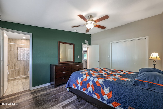 bedroom with dark wood-type flooring, a closet, ensuite bathroom, and ceiling fan