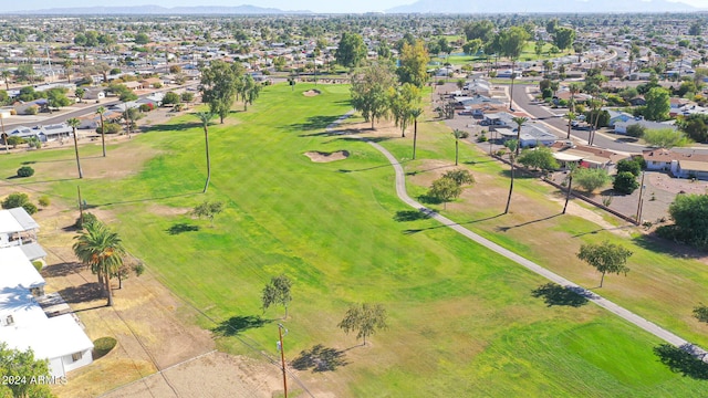 bird's eye view featuring a mountain view, view of golf course, and a residential view