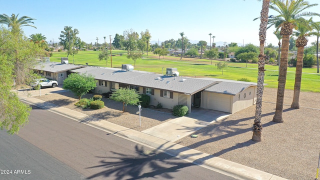 view of front of house with a front yard and a garage