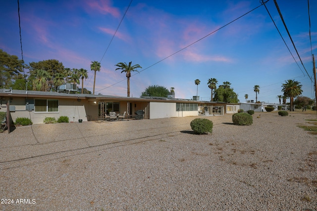 single story home featuring a patio