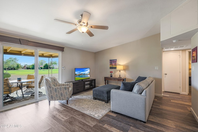 living room featuring ceiling fan and dark hardwood / wood-style flooring