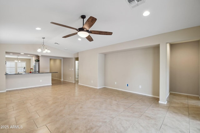 unfurnished living room featuring baseboards, visible vents, vaulted ceiling, and ceiling fan with notable chandelier