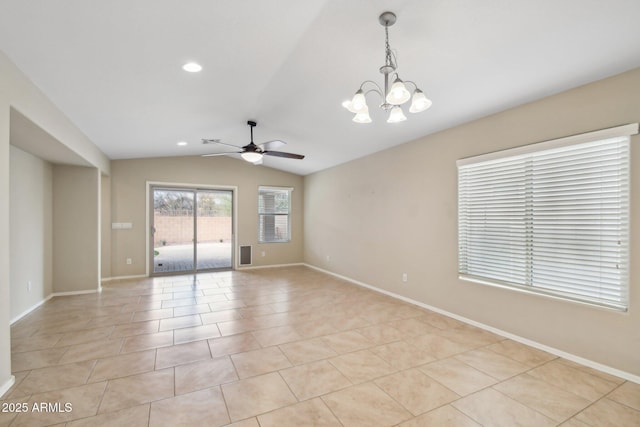 spare room with vaulted ceiling, ceiling fan with notable chandelier, light tile patterned flooring, and baseboards