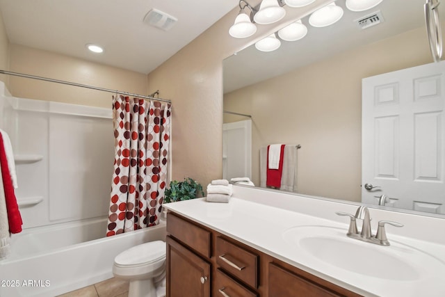 full bath featuring toilet, vanity, visible vents, and tile patterned floors