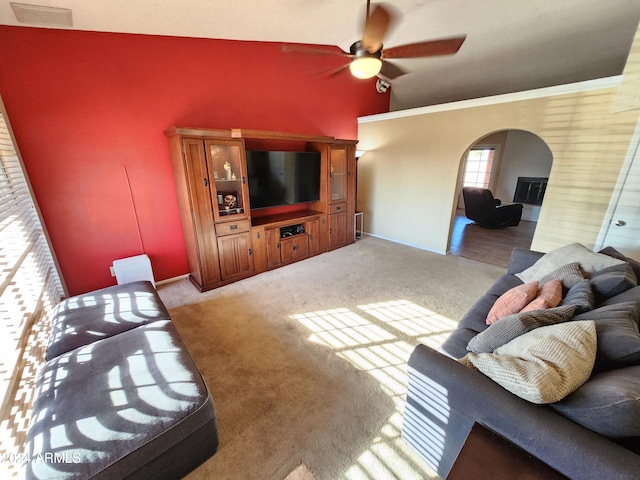 living room featuring light carpet, high vaulted ceiling, and ceiling fan