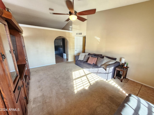 living room with crown molding, light colored carpet, and ceiling fan