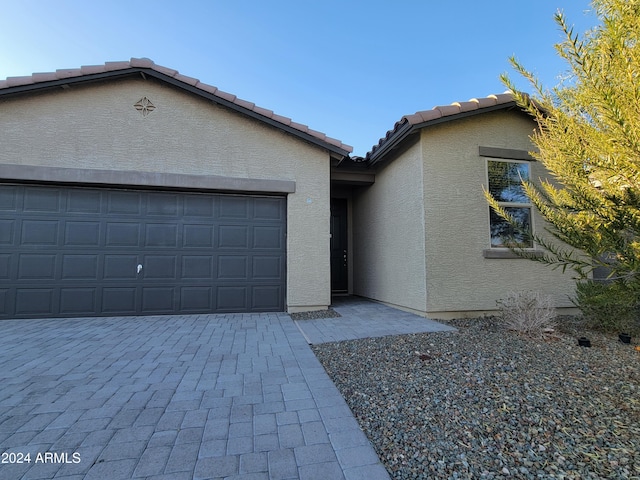 view of front of property with a garage