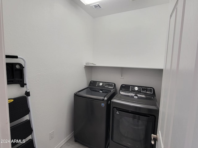 washroom with washer and clothes dryer