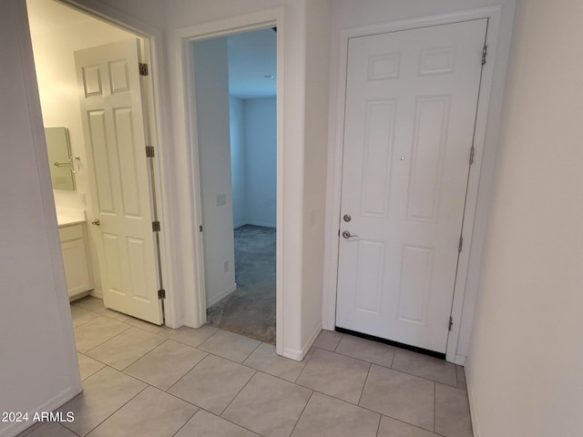 corridor with light tile patterned floors