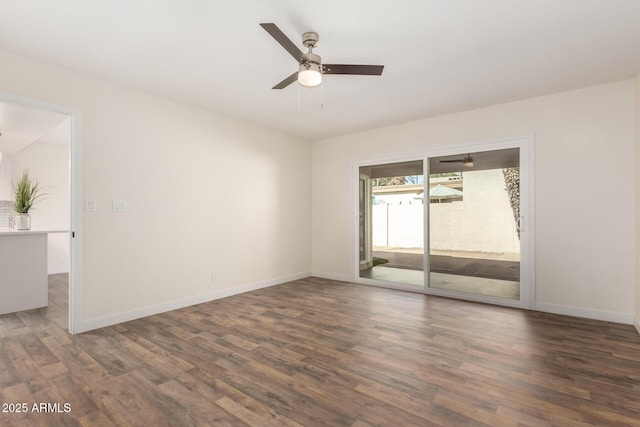 spare room featuring ceiling fan and dark hardwood / wood-style flooring