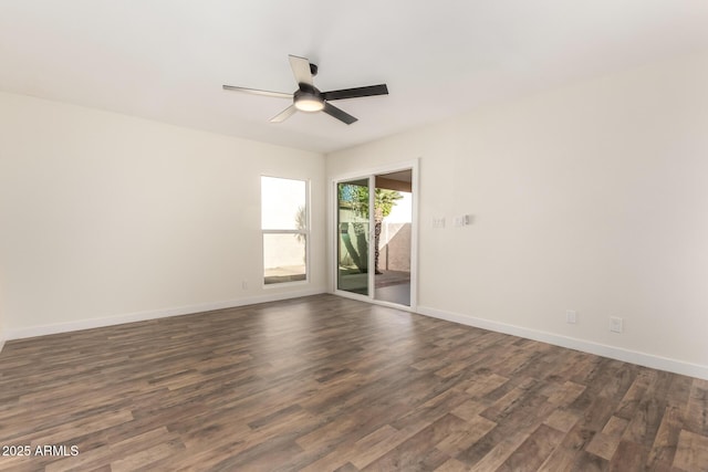 spare room with ceiling fan and dark hardwood / wood-style floors