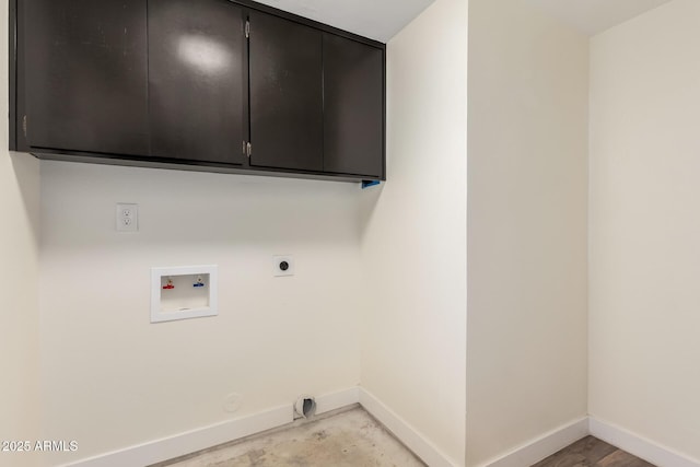 laundry room with electric dryer hookup, hookup for a washing machine, cabinets, and gas dryer hookup