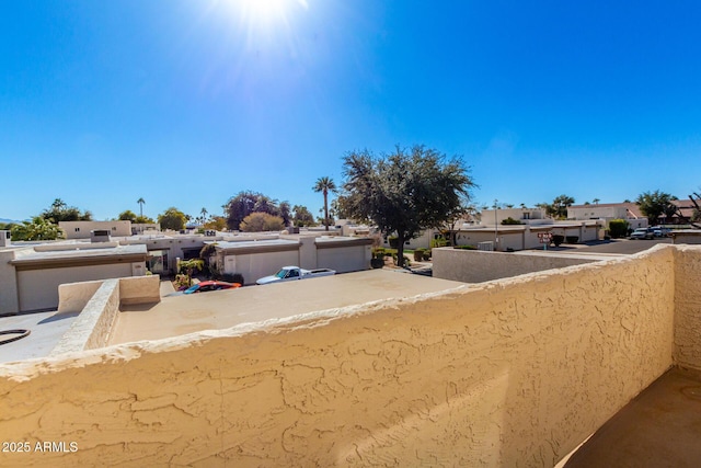 pueblo-style house featuring a balcony