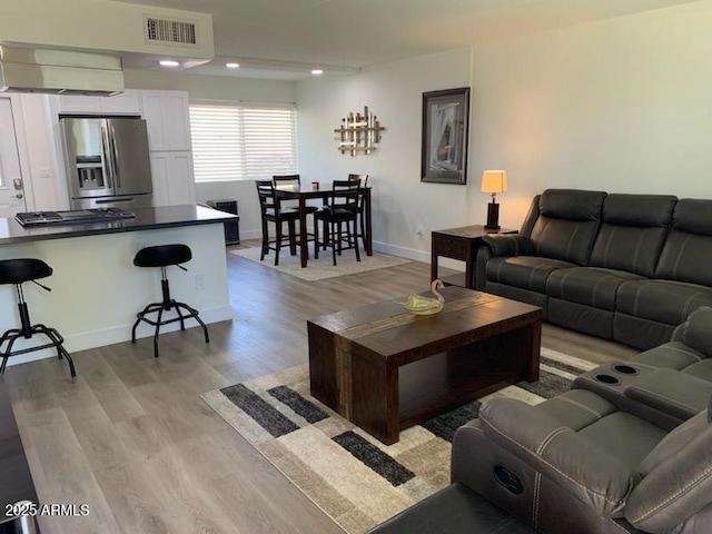 living room with light hardwood / wood-style flooring