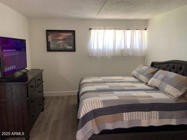 bedroom featuring dark hardwood / wood-style floors