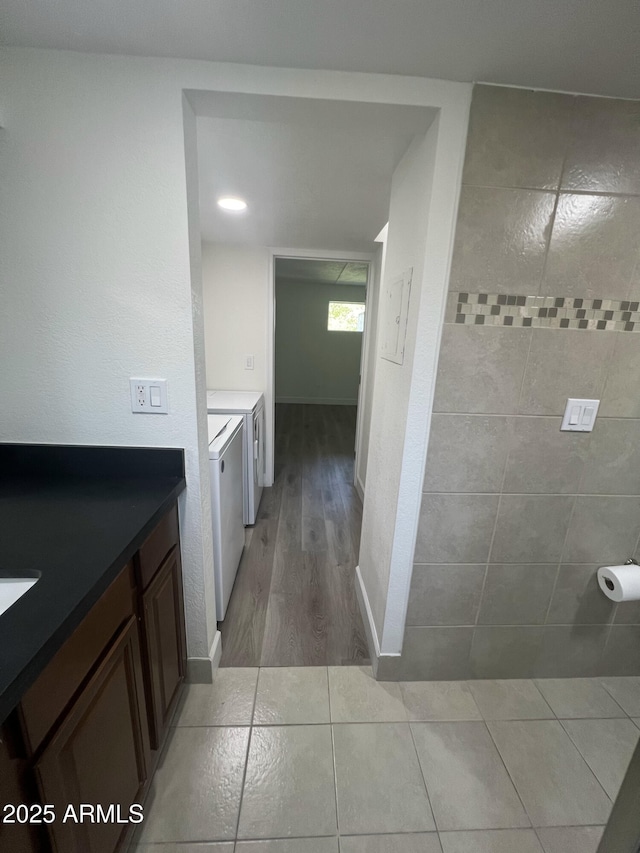 bathroom featuring washer and clothes dryer