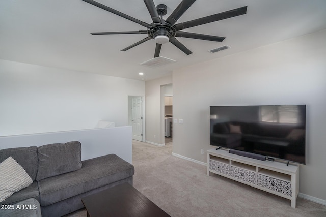 living room featuring light carpet and ceiling fan