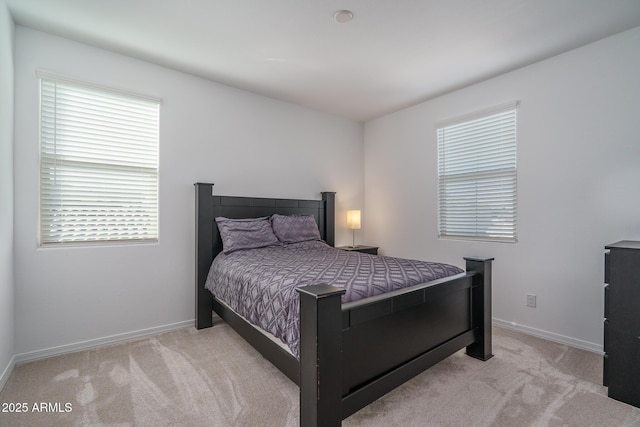 bedroom featuring light colored carpet