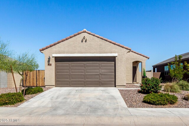3670 E Sandoval Dr, San Tan Valley, AZ 85140 - mediterranean / spanish-style home with a garage, driveway, stucco siding, and fence