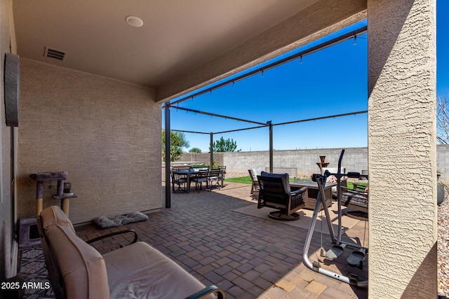 3670 E Sandoval Dr, San Tan Valley, AZ 85140 - view of patio featuring visible vents, fence, and outdoor dining space