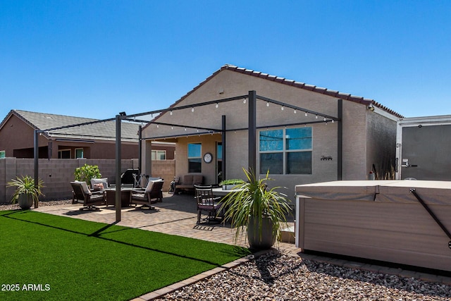3670 E Sandoval Dr, San Tan Valley, AZ 85140 - rear view of property with stucco siding, fence, a hot tub, a patio, and a yard