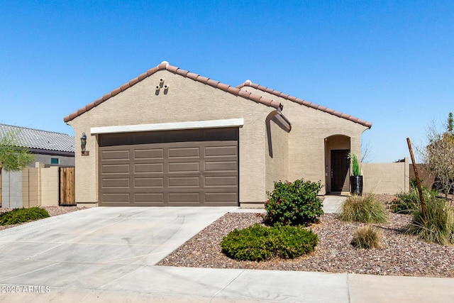 3670 E Sandoval Dr, San Tan Valley, AZ 85140 - mediterranean / spanish home featuring concrete driveway, stucco siding, fence, and an attached garage