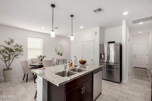 3670 E Sandoval Dr, San Tan Valley, AZ 85140 - kitchen with a sink, visible vents, appliances with stainless steel finishes, and dark brown cabinets