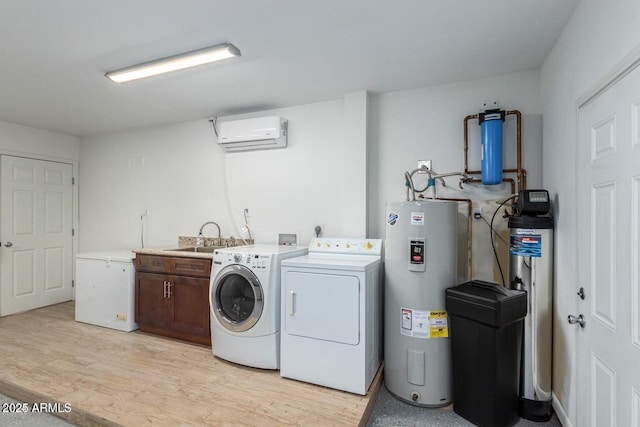 washroom with sink, cabinets, a wall mounted AC, separate washer and dryer, and electric water heater