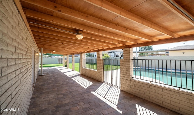 view of patio with a fenced in pool