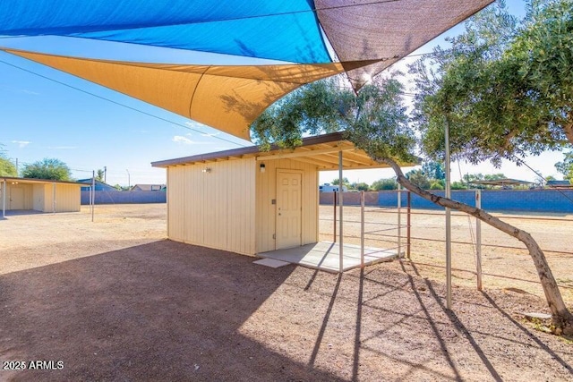 view of patio / terrace with a storage shed