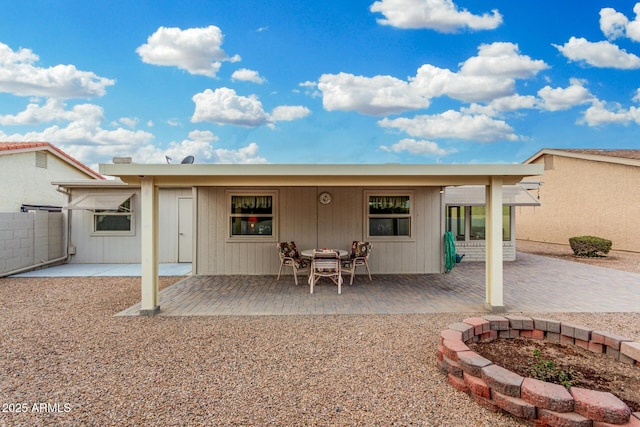 rear view of property featuring a patio area