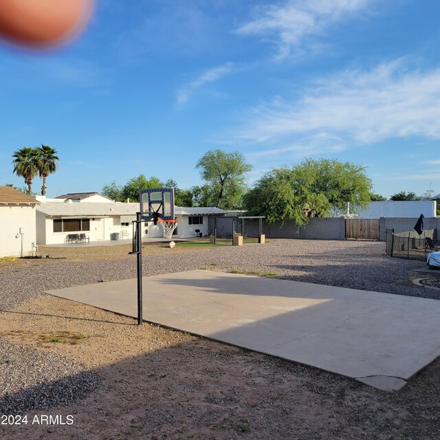 view of patio with basketball hoop