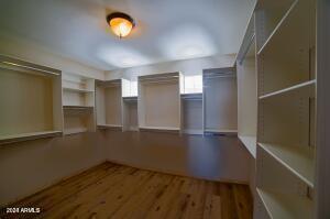 spacious closet featuring hardwood / wood-style floors