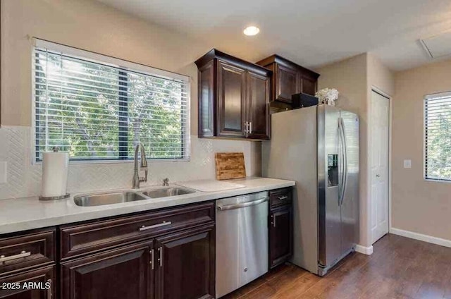 15252 N 100th St Unit 2157, Scottsdale, AZ 85260 - kitchen with stainless steel appliances, a sink, light countertops, wood finished floors, and dark brown cabinets