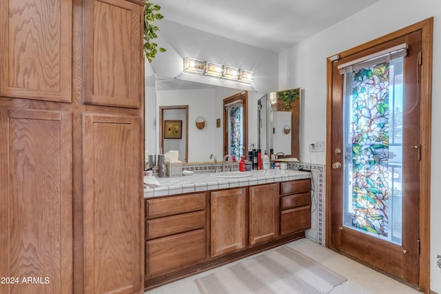 bathroom with plenty of natural light and vanity